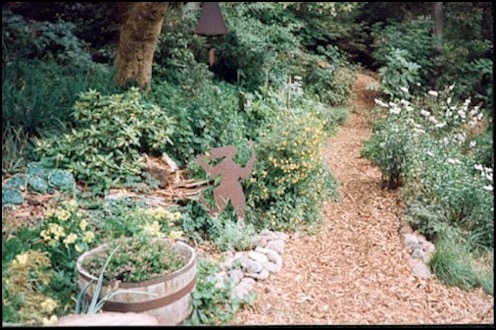 Path with flowers and sculpture